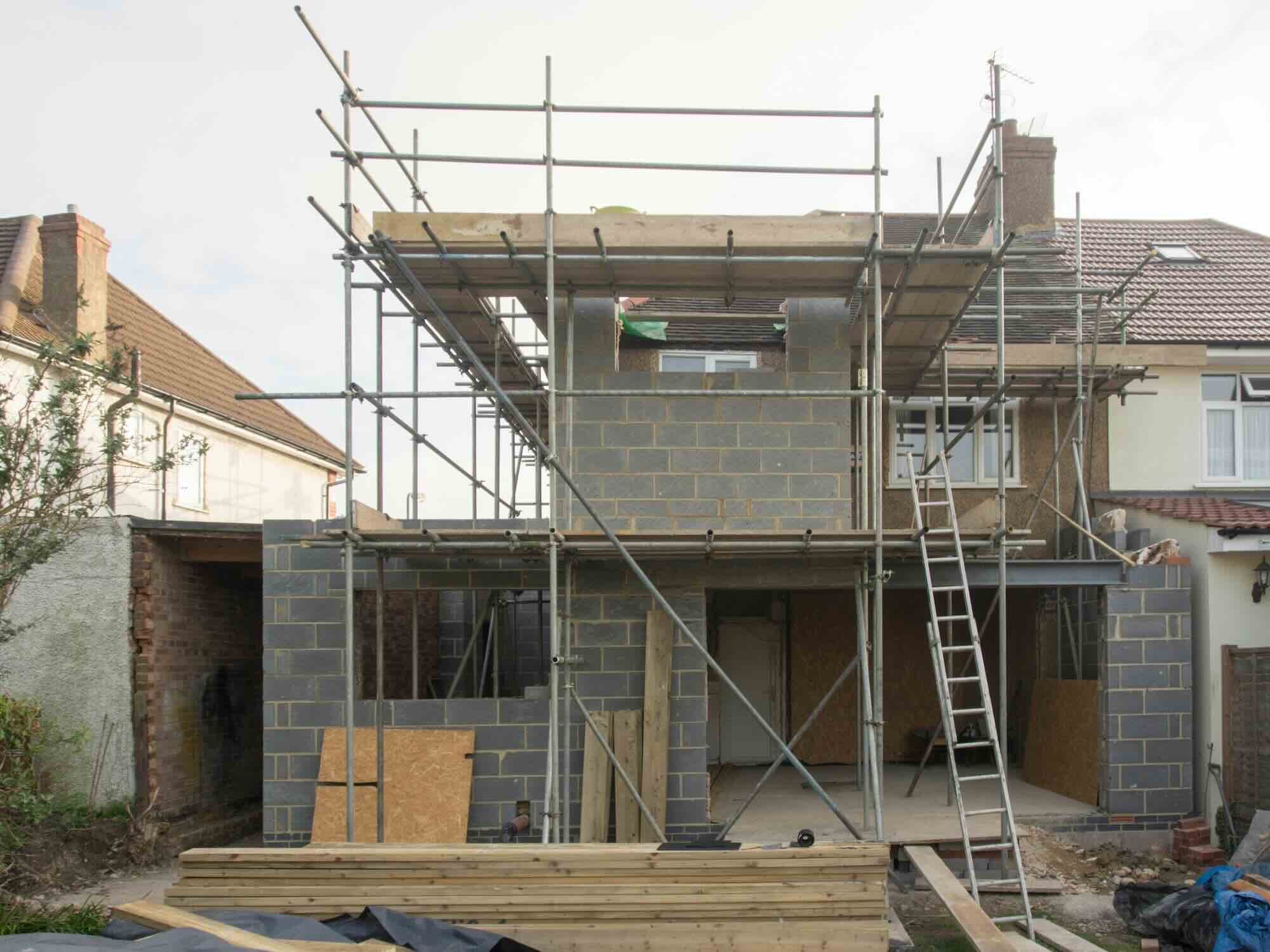 Building Foundation for Two-Story Extension with Focus on Party Wall Integrity