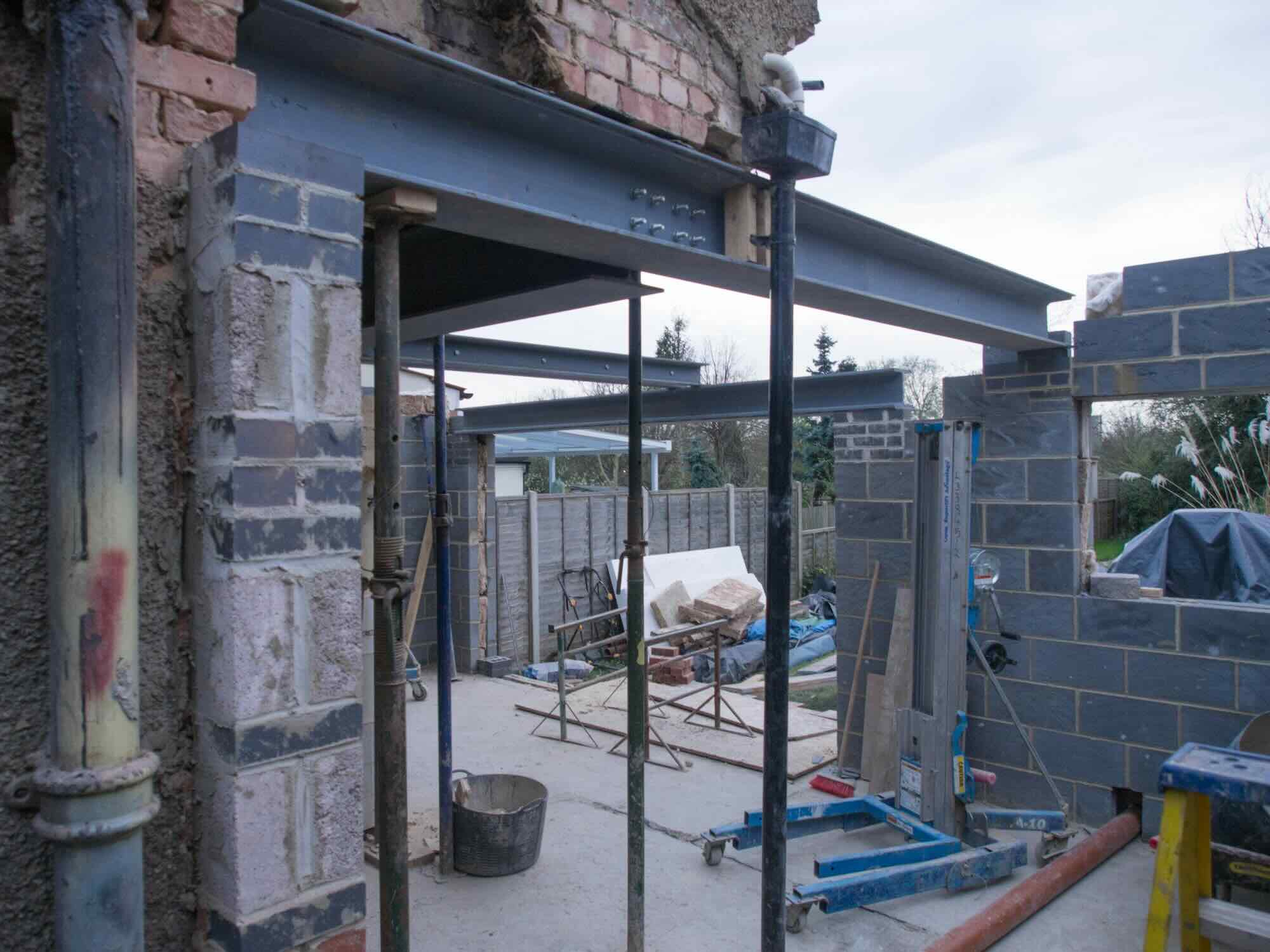 Completed Two-Story Extension with Reinforced Party Wall Adhering to Legal Requirements